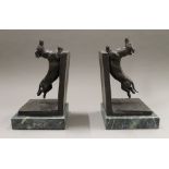 A pair of bronze dog bookends. 32 cm high.