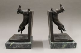 A pair of bronze dog bookends. 32 cm high.