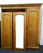 A Victorian satin walnut triple wardrobe. Approximately 185 cm wide x 208 cm high.