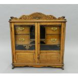 A Victorian smoker's cabinet. 56.5 cm wide.