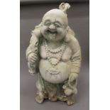 A large plaster model of a happy buddha. 89 cm high.