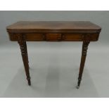 A Victorian mahogany card table. 91.5 cm wide.
