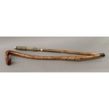A walking stick with sailors ropework and silver band engraved S S Selria and a vintage carved