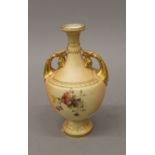 A Royal Worcester blush ivory twin handled vase. 18 cm high.
