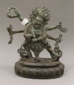 A multi-armed bronze deity. 24 cm high.