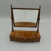 A 19th century mahogany three drawer toilet mirror. 57 cm wide.