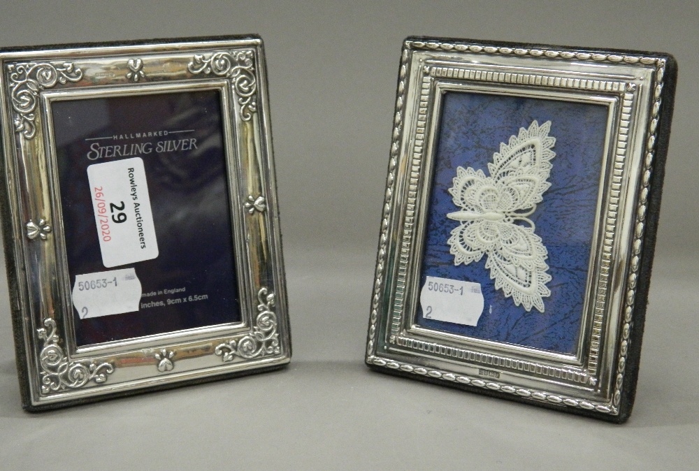 Two small silver photograph frames. Each approximately 10.5 cm x 13 cm.