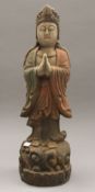 A painted wood figure of Guanyin. 55 cm high.