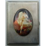 A silver cigarette case decorated with a nude lady. 805 cm wide. 190.7 grammes total weight.