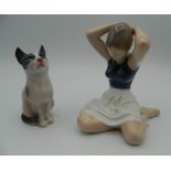 A Royal Copenhagen porcelain model of a ballerina and a cat. The former 12 cm high.