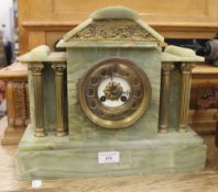 A Victorian onyx mantle clock. 36 cm wide.