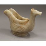 A Chinese archaistic jade duck form vase. 17.5 cm high.