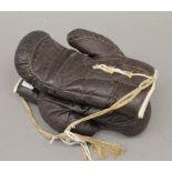 A pair of vintage boxing gloves. 23 cm long.