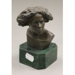 A small bronze bust. 14.5 cm high.