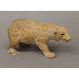 A late 19th century pottery model of a polar bear. 21 cm long.