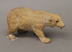 A late 19th century pottery model of a polar bear. 21 cm long.