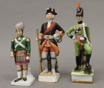 Three porcelain soldiers. The largest 21.5 cm high.