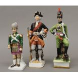 Three porcelain soldiers. The largest 21.5 cm high.