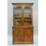 A Victorian inlaid walnut bookcase cabinet. 107 cm wide x 203 cm high.