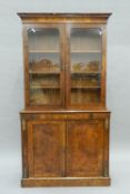 A Victorian inlaid walnut bookcase cabinet. 107 cm wide x 203 cm high.