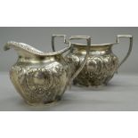 A silver sugar bowl and a matching cream jug. The former 16.5 cm wide. 11.3 troy ounces.