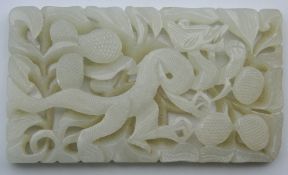 A pierced jade plaque. 9 cm wide.