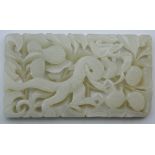 A pierced jade plaque. 9 cm wide.