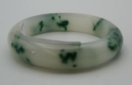 A jade bangle. 7.5 cm diameter.