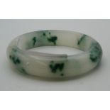 A jade bangle. 7.5 cm diameter.