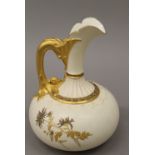 A Royal Worcester gilt heightened ewer. 20 cm high.