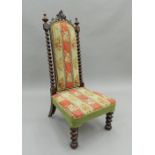 A Victorian tapestry covered rosewood barley twist nursing chair. 111 cm high.