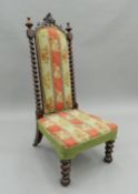 A Victorian tapestry covered rosewood barley twist nursing chair. 111 cm high.