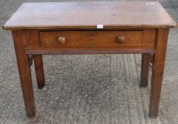 A Victorian pitch pine gothic side table. 115 cm wide.