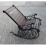 A cast iron garden rocking chair. 62 cm wide.