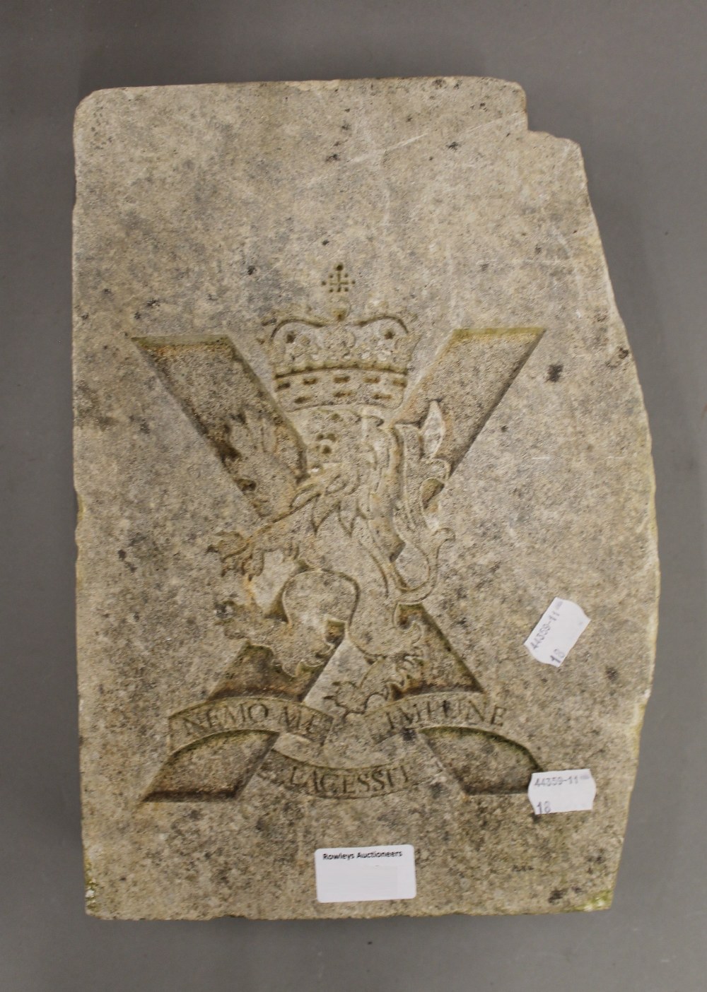A Regimental stone carving. 33 cm high.