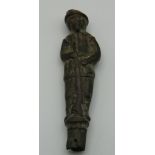 An usual antique bronze finial, formed as a soldier and dog. 8 cm high.