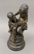 An early 20th century bronzed model, La Grande Soeur, After Auguste Moreau. 48 cm high.