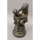 An early 20th century bronzed model, La Grande Soeur, After Auguste Moreau. 48 cm high.