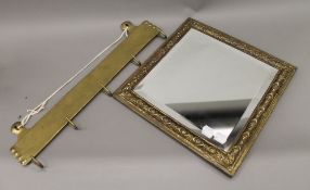 A set of brass hooks and a brass framed mirror. The latter 33.5 cm wide.