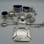 A quantity of small silver items, including salts, inkwell, etc. 9.7 grammes of weighable silver.