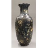 An Oriental papier mache vase. 45.5 cm high.