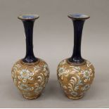 A pair of Royal Doulton pottery vases. 25.5 cm high.