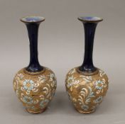 A pair of Royal Doulton pottery vases. 25.5 cm high.