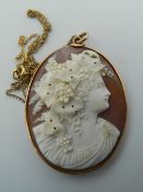 A 19th century carved cameo shell pendant, with 9 ct gold surround and 925 silver chain.