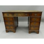 A reproduction pedestal desk. 122.5 cm wide. The property of Germaine Greer.