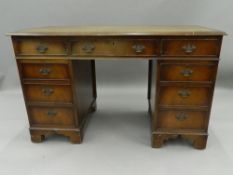 A reproduction pedestal desk. 122.5 cm wide. The property of Germaine Greer.