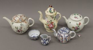 An 18th century porcelain teapot possibly Lowestoft or Liverpool, together with another teapot,