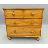 A Victorian satin walnut chest of drawers. 93 cm wide. The property of Germaine Greer.
