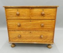 A Victorian satin walnut chest of drawers. 93 cm wide. The property of Germaine Greer.