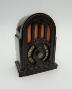 A bakelite pencil sharpener formed as a wireless. 6 cm high.